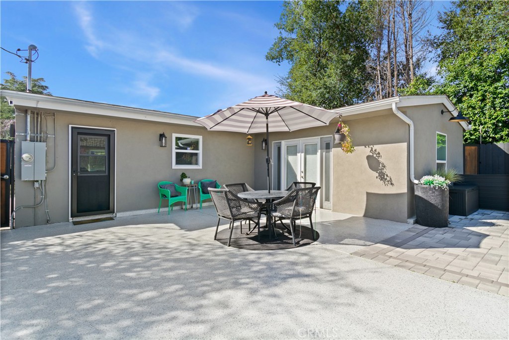 275 Mountain View Street Altadena, CA 91001 - Photo 29 of 30 a patio with a table and chairs under an umbrella