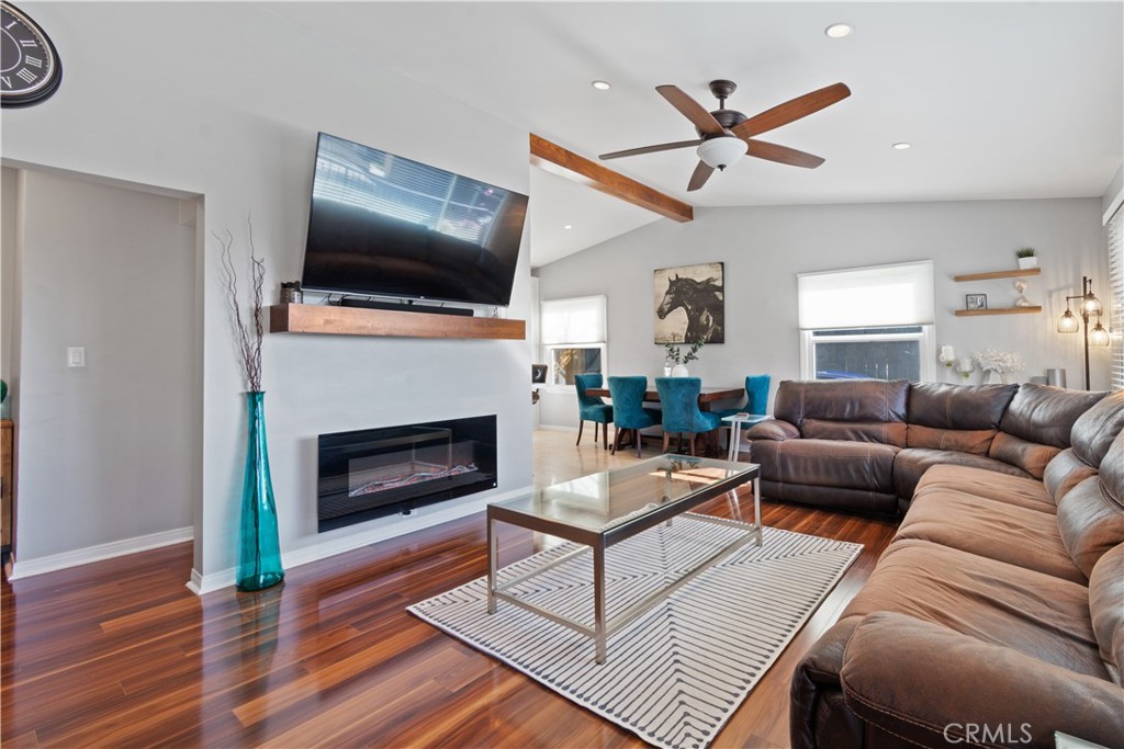 275 Mountain View Street Altadena, CA 91001 - Photo 7 of 30 a living room with furniture a flat screen tv and a fireplace