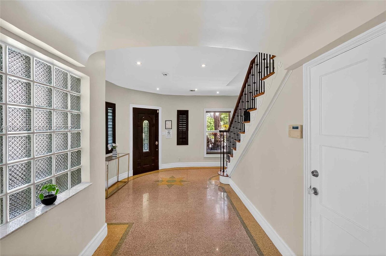 1051 Northeast 89th Street Miami, FL 33138 - Photo 14 of 71 a view of an entryway with wooden floor and windows