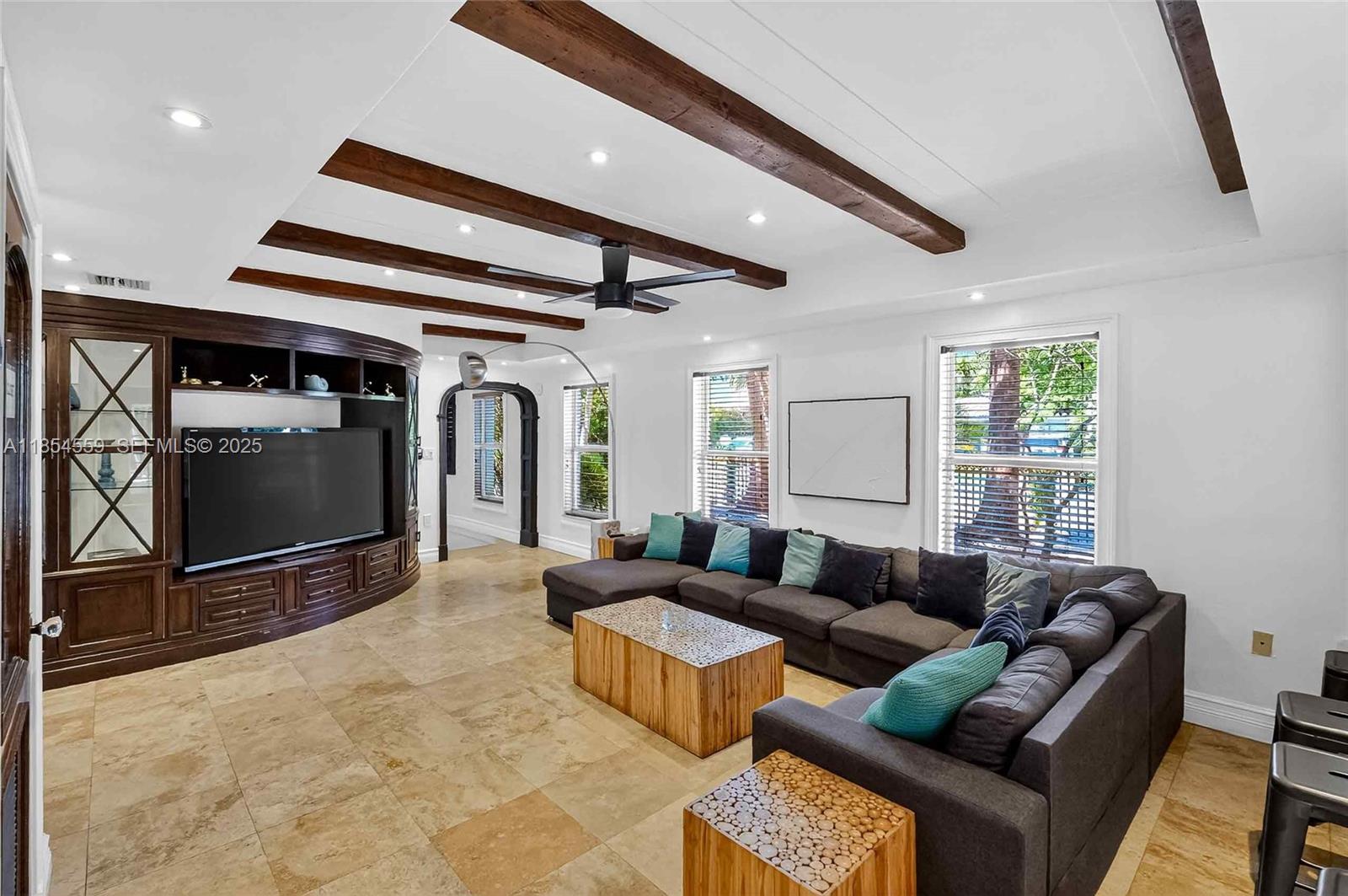 1051 Northeast 89th Street Miami, FL 33138 - Photo 17 of 71 a living room with furniture and a flat screen tv