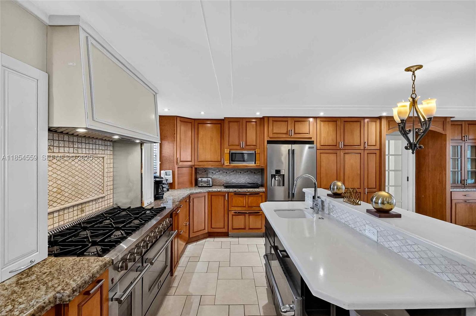 1051 Northeast 89th Street Miami, FL 33138 - Photo 22 of 71 a kitchen with counter top space appliances and cabinets