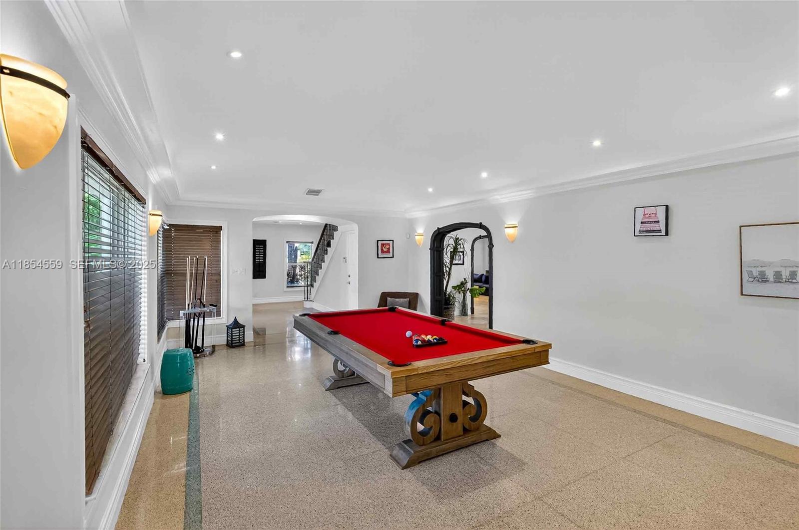 1051 Northeast 89th Street Miami, FL 33138 - Photo 27 of 71 a living room with a table and gym equipment