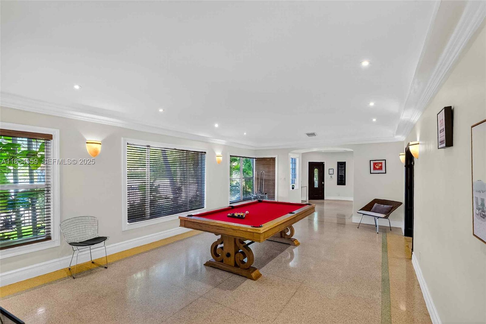 1051 Northeast 89th Street Miami, FL 33138 - Photo 28 of 71 a living room with furniture pool table and a large window