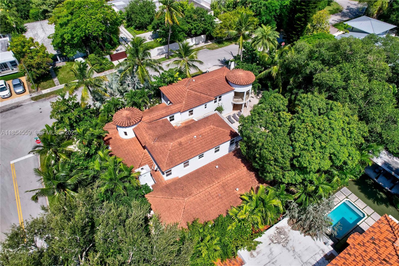 1051 Northeast 89th Street Miami, FL 33138 - Photo 3 of 71 an aerial view of a house with a yard and garden