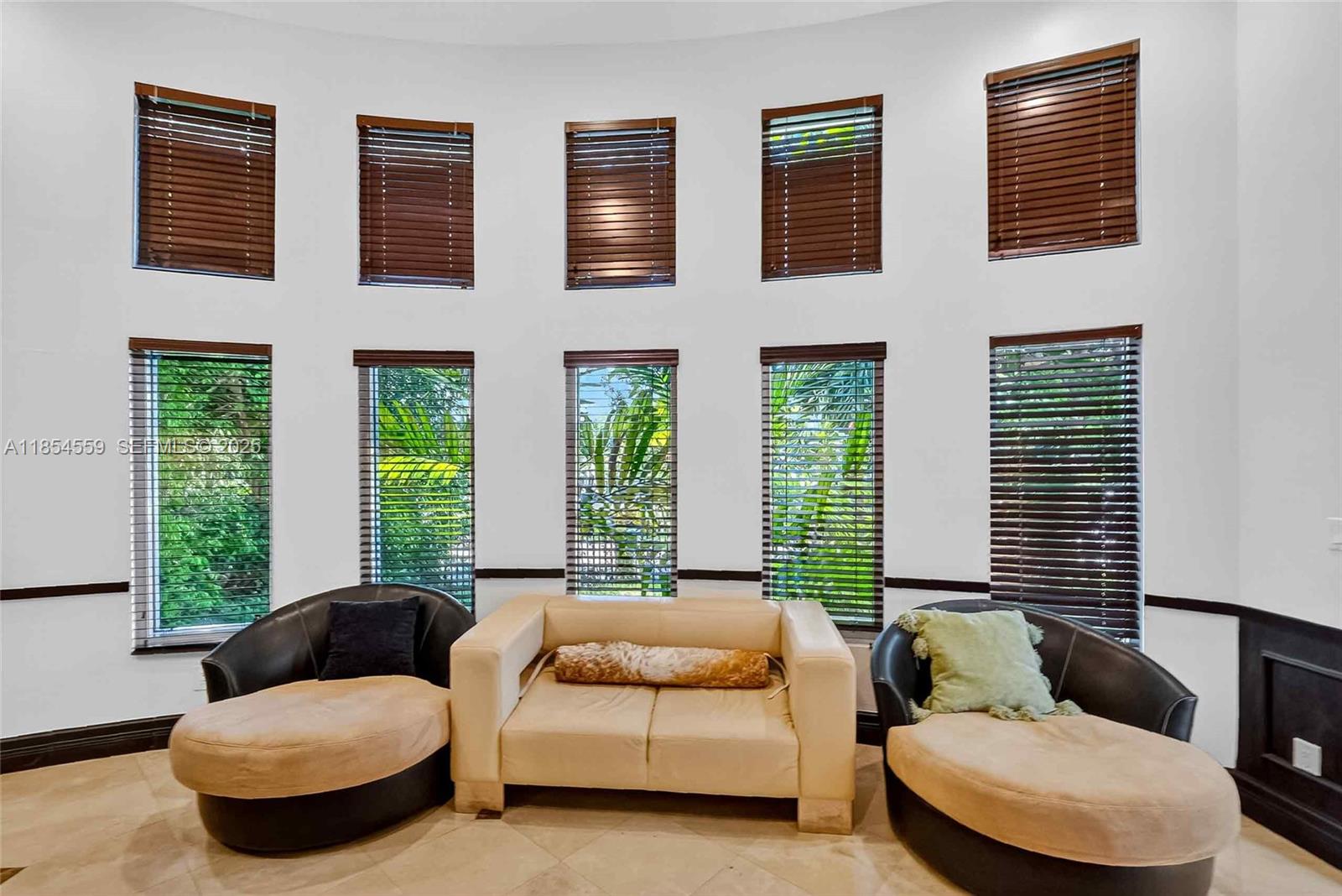 1051 Northeast 89th Street Miami, FL 33138 - Photo 35 of 71 a living room with furniture and a large window
