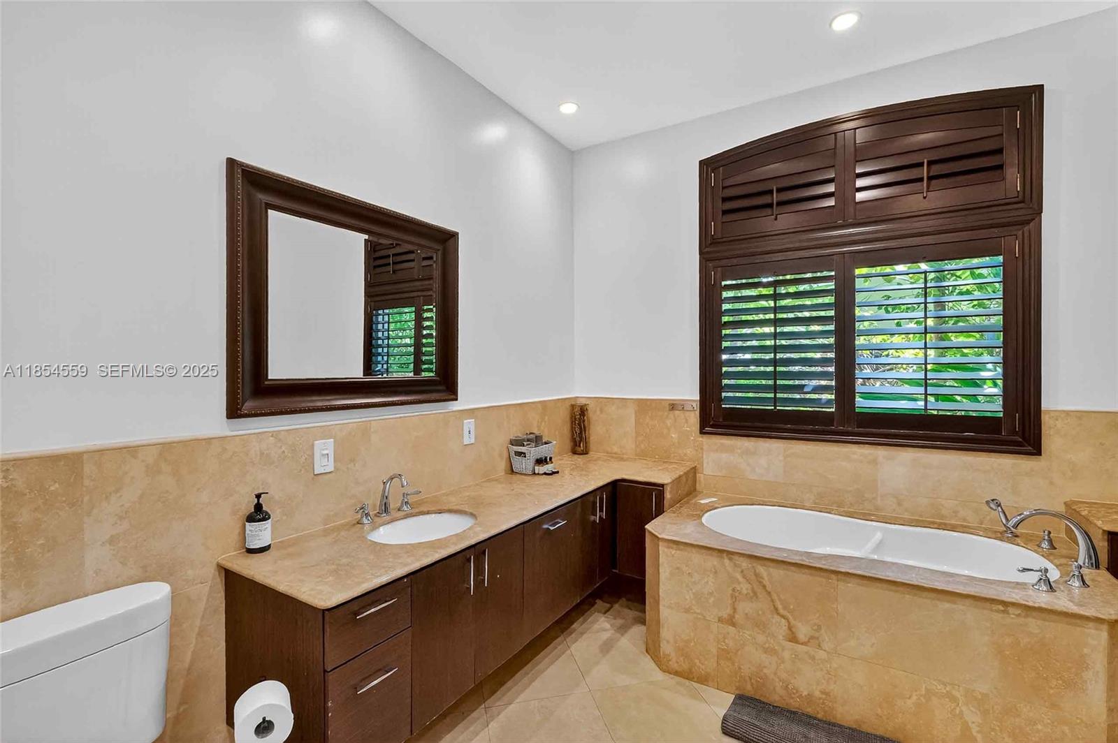 1051 Northeast 89th Street Miami, FL 33138 - Photo 43 of 71 a bathroom with a sink and a bathtub