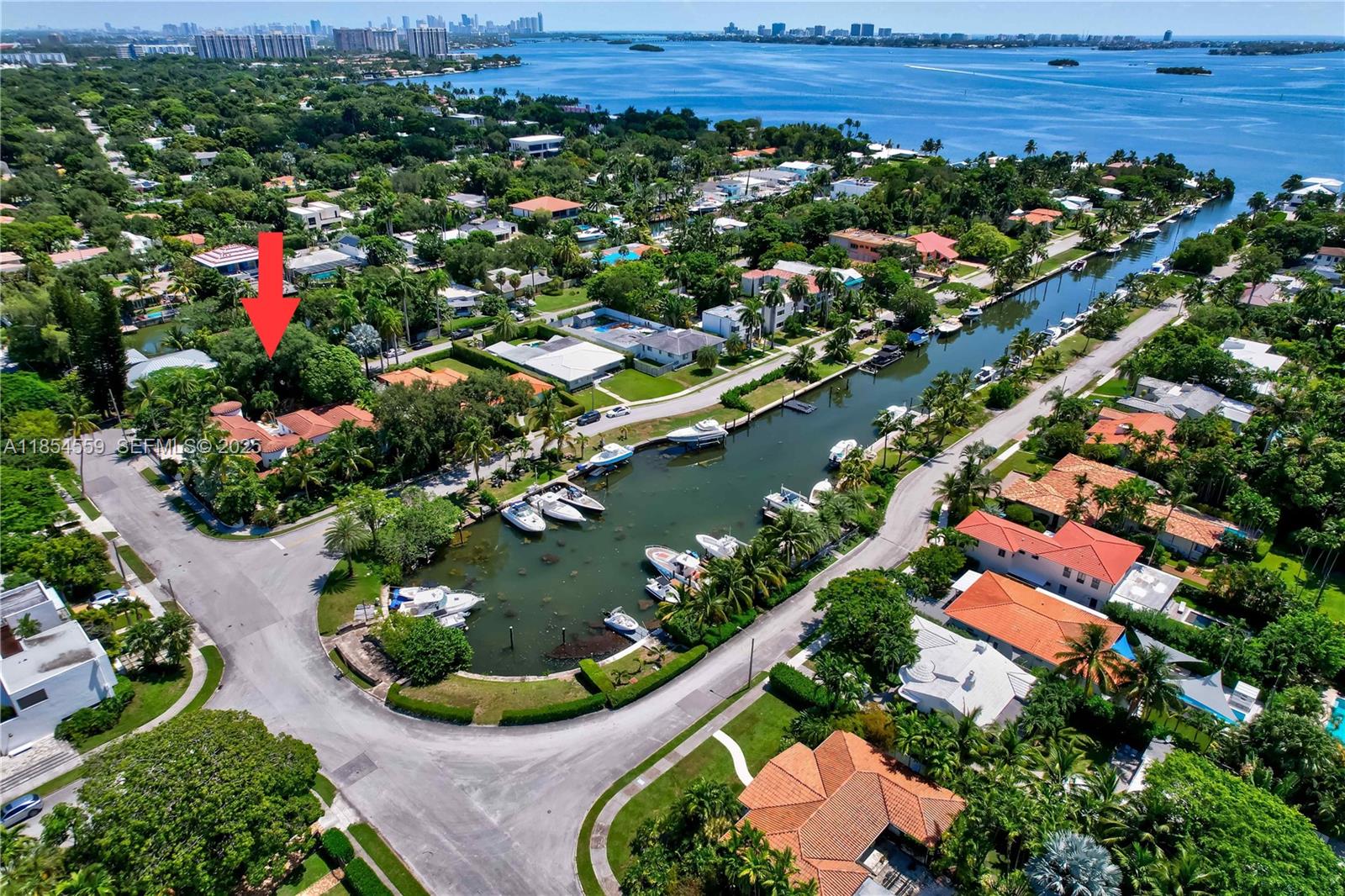 1051 Northeast 89th Street Miami, FL 33138 - Photo 8 of 71 an aerial view of residential houses with outdoor space and trees