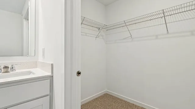 a bathroom with a sink and vanity