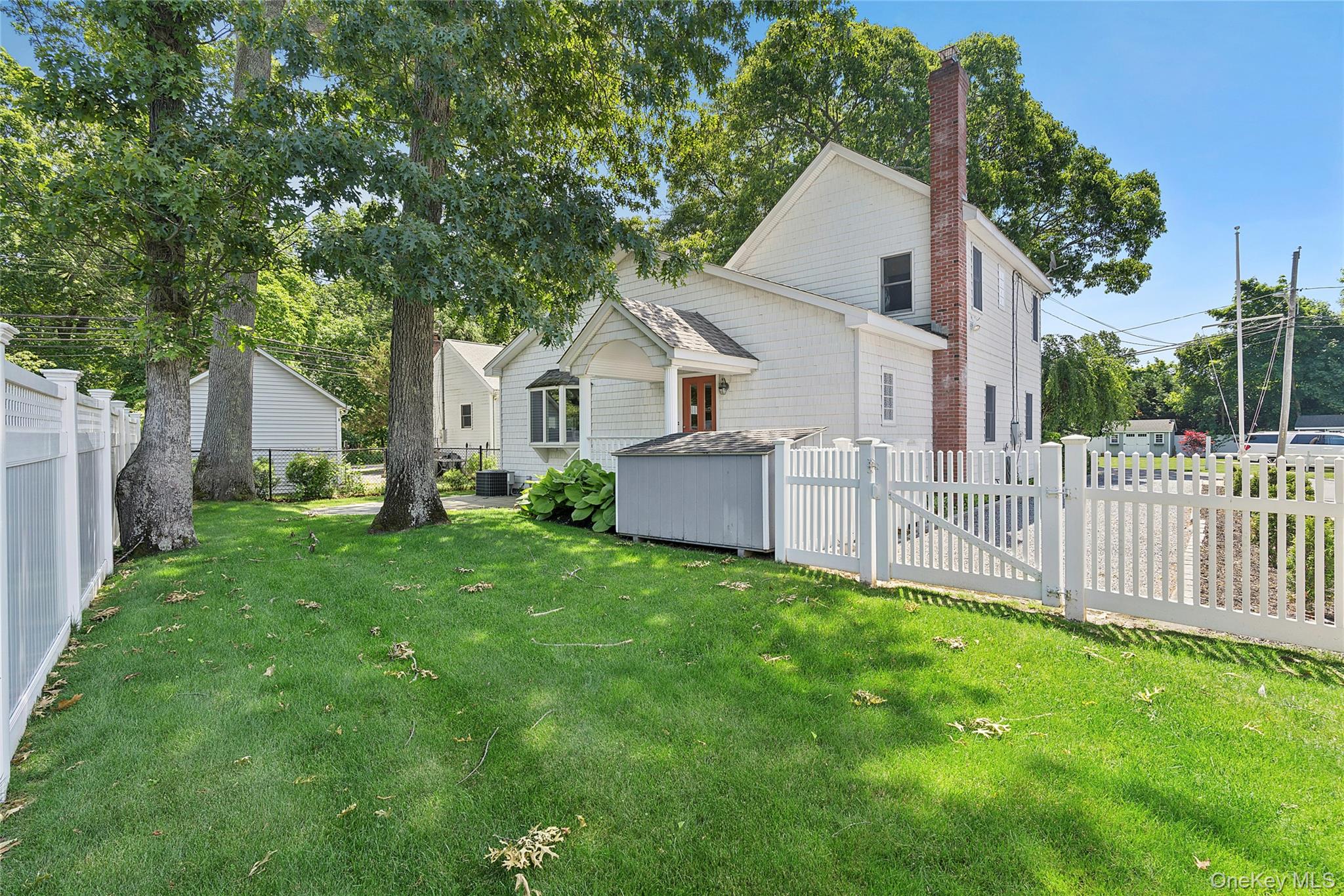 54 Breezy Point Road Wading River, NY 11792 - Photo 15 of 17 Lush, private yard