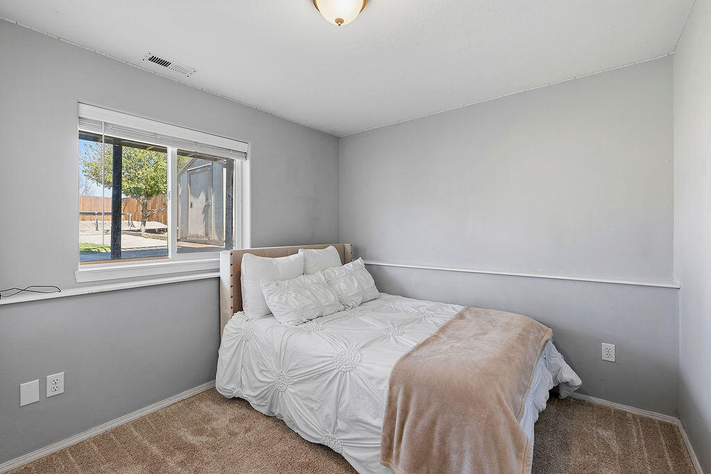 2979 Northeast Sugar Pine Road Prineville, OR 97754 - Photo 18 of 31 a bedroom with a bed and window