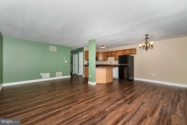 a view of a kitchen cabinets and wooden floor