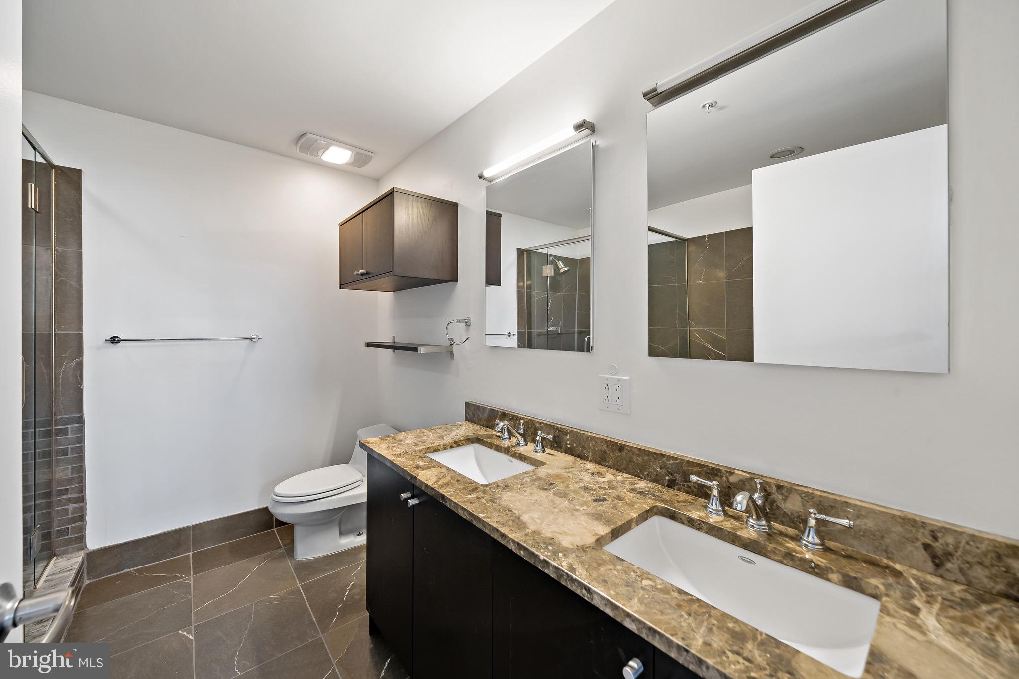 1101 Locust Street, Unit 7I Philadelphia, PA 19107 - Photo 13 of 27 a bathroom with a sink and a mirror