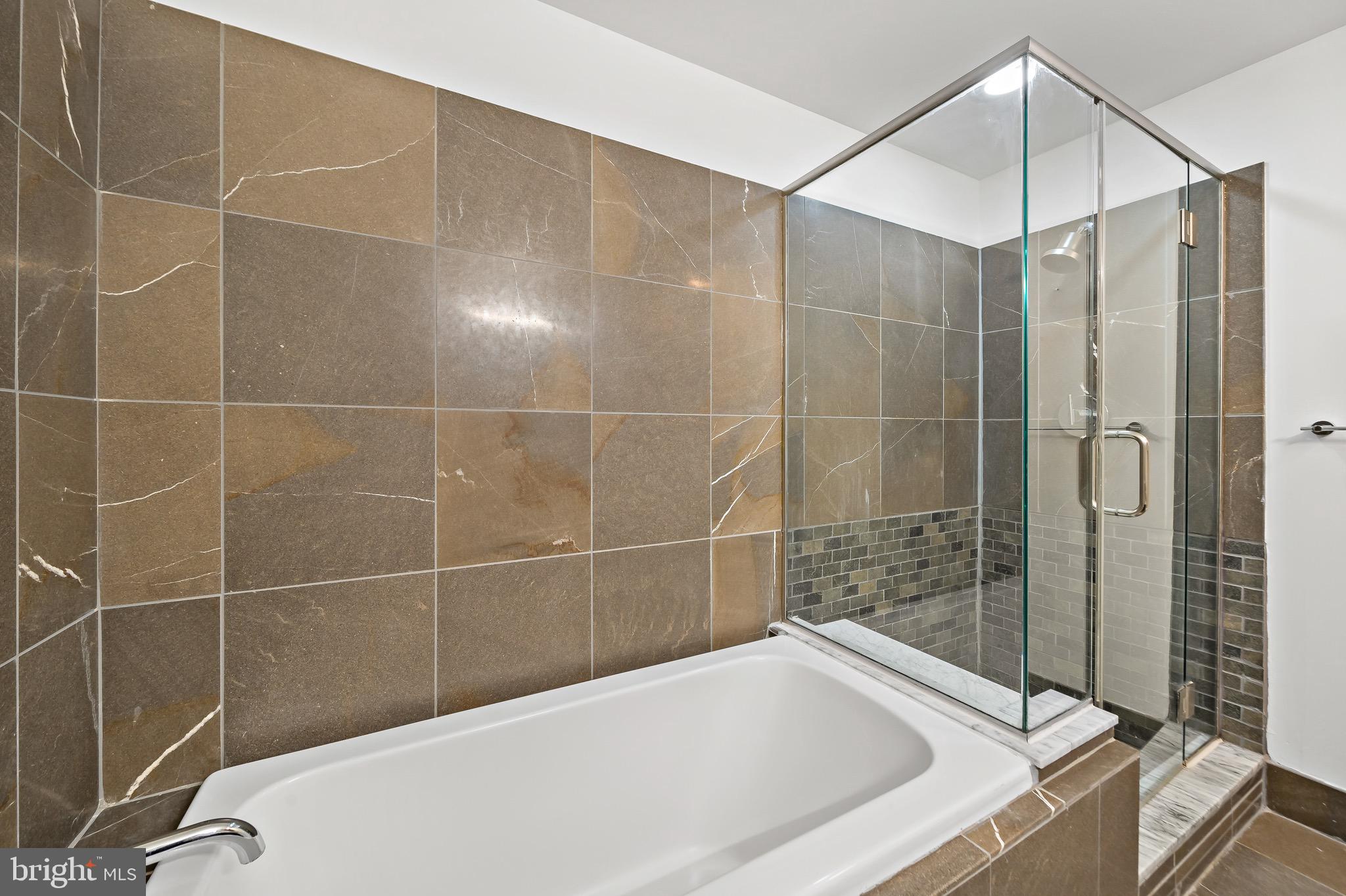 1101 Locust Street, Unit 7I Philadelphia, PA 19107 - Photo 14 of 27 a bathroom with a bathtub and shower