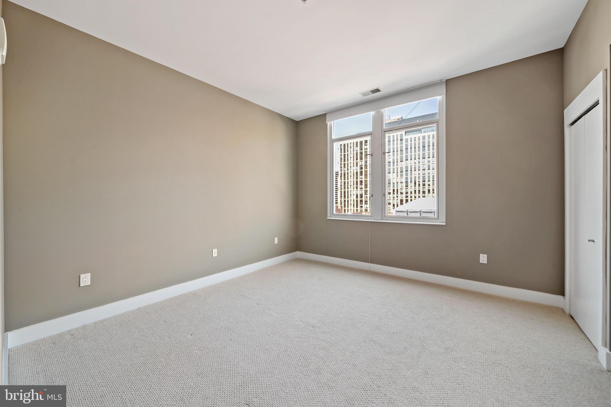 1101 Locust Street, Unit 7I Philadelphia, PA 19107 - Photo 16 of 27 a view of an empty room with a window