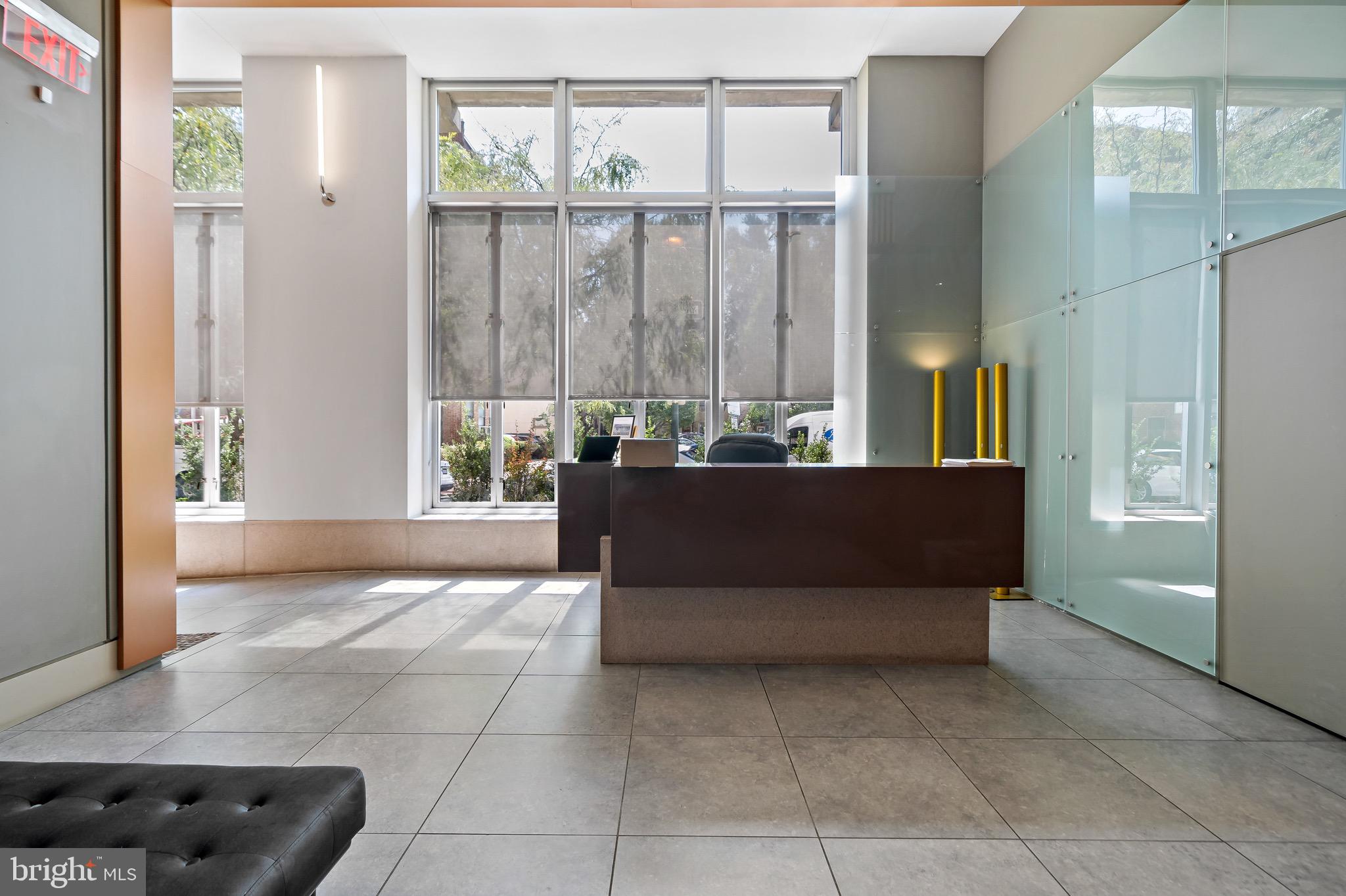 1101 Locust Street, Unit 7I Philadelphia, PA 19107 - Photo 23 of 27 a living room with furniture and a window