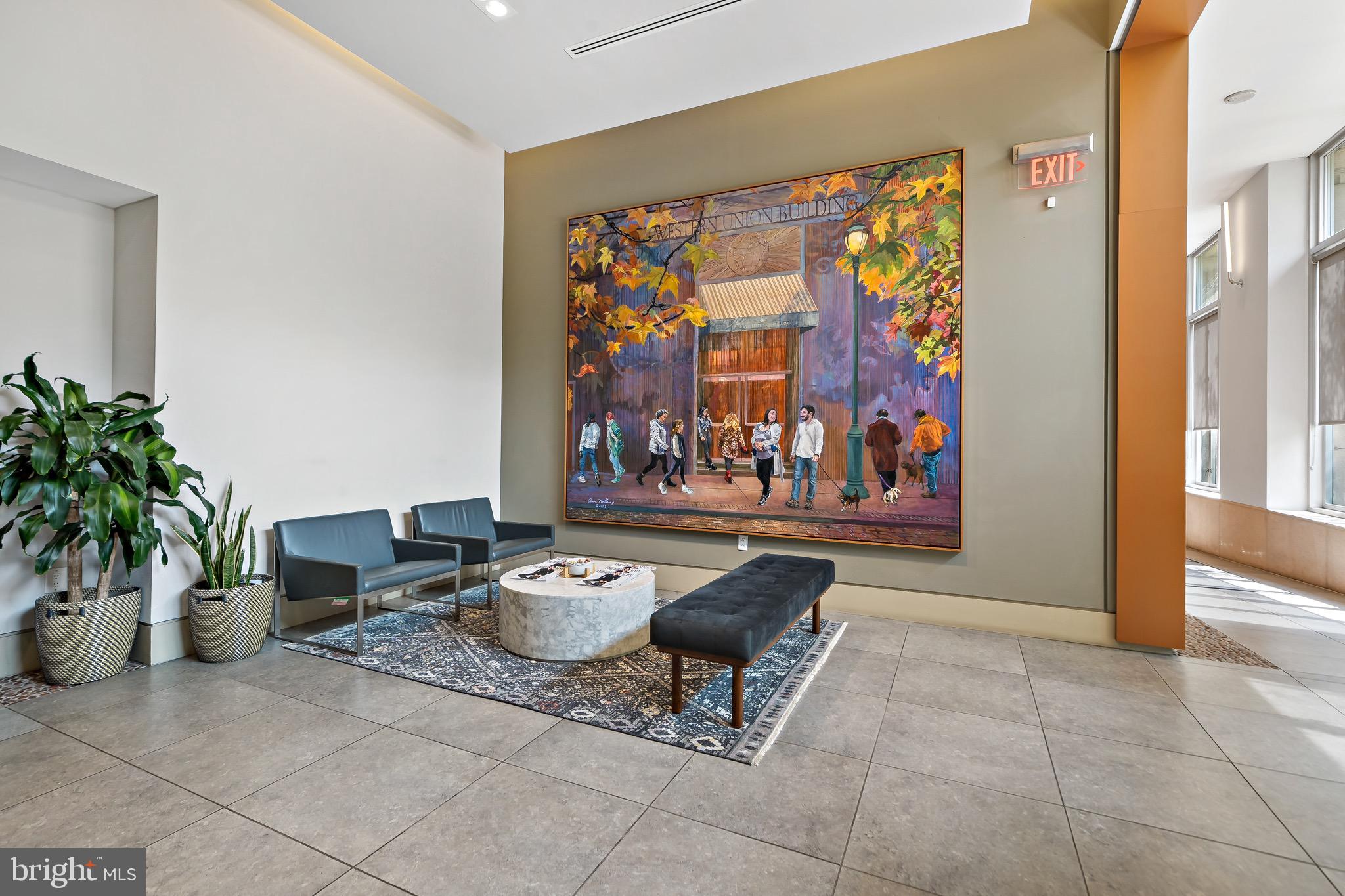 1101 Locust Street, Unit 7I Philadelphia, PA 19107 - Photo 24 of 27 a living room with furniture and a potted plant