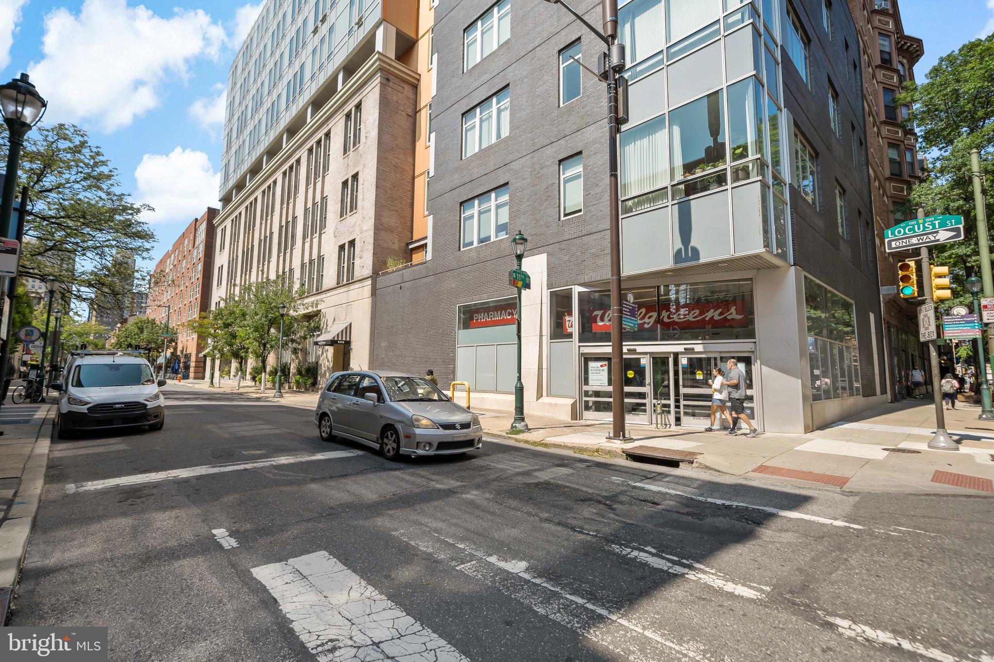 1101 Locust Street, Unit 7I Philadelphia, PA 19107 - Photo 26 of 27 a car parked in front of brick building