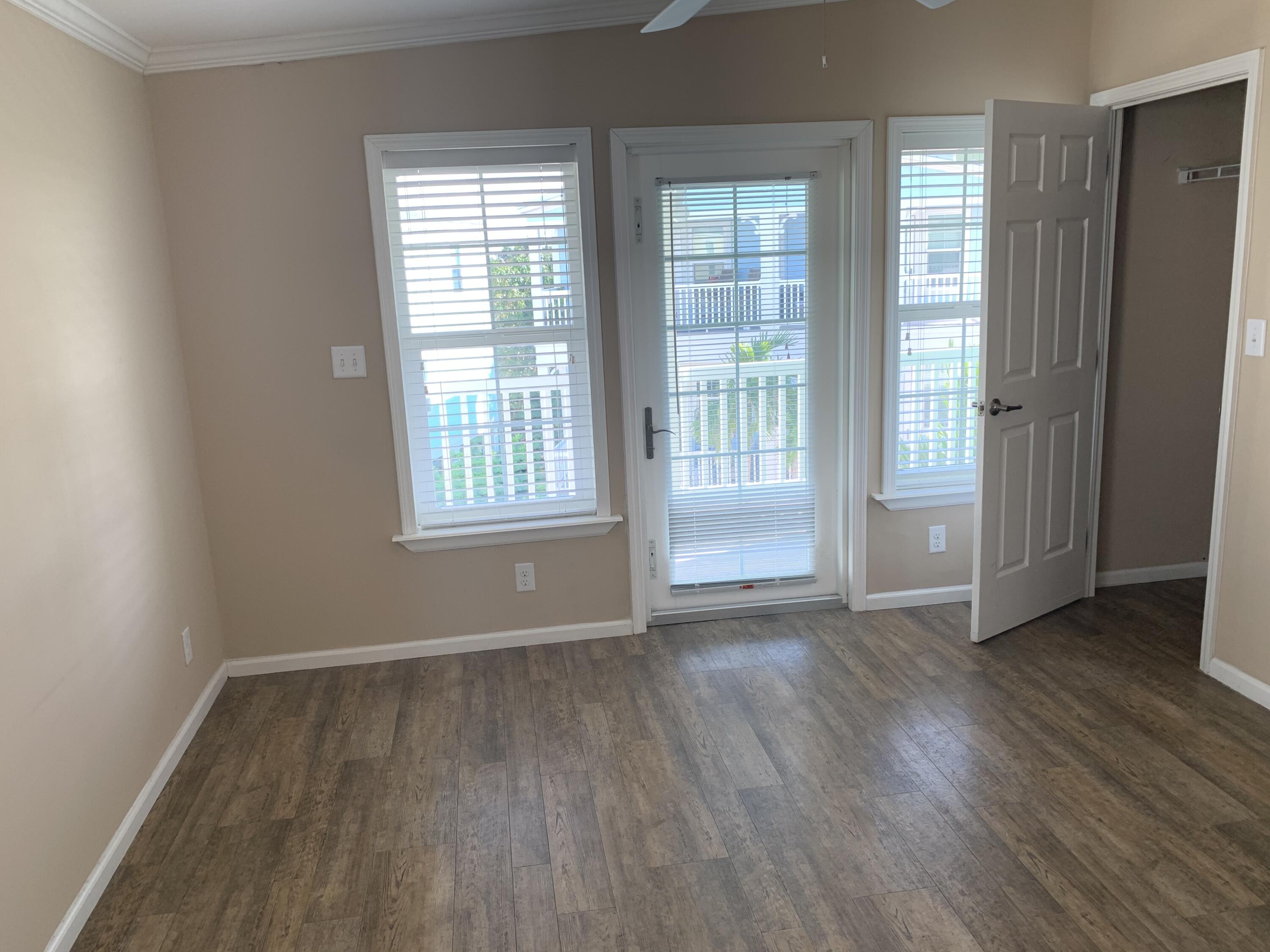 28511 Channel View Drive Summerland Key, FL 33042 - Photo 4 of 14 an empty room with wooden floor and windows