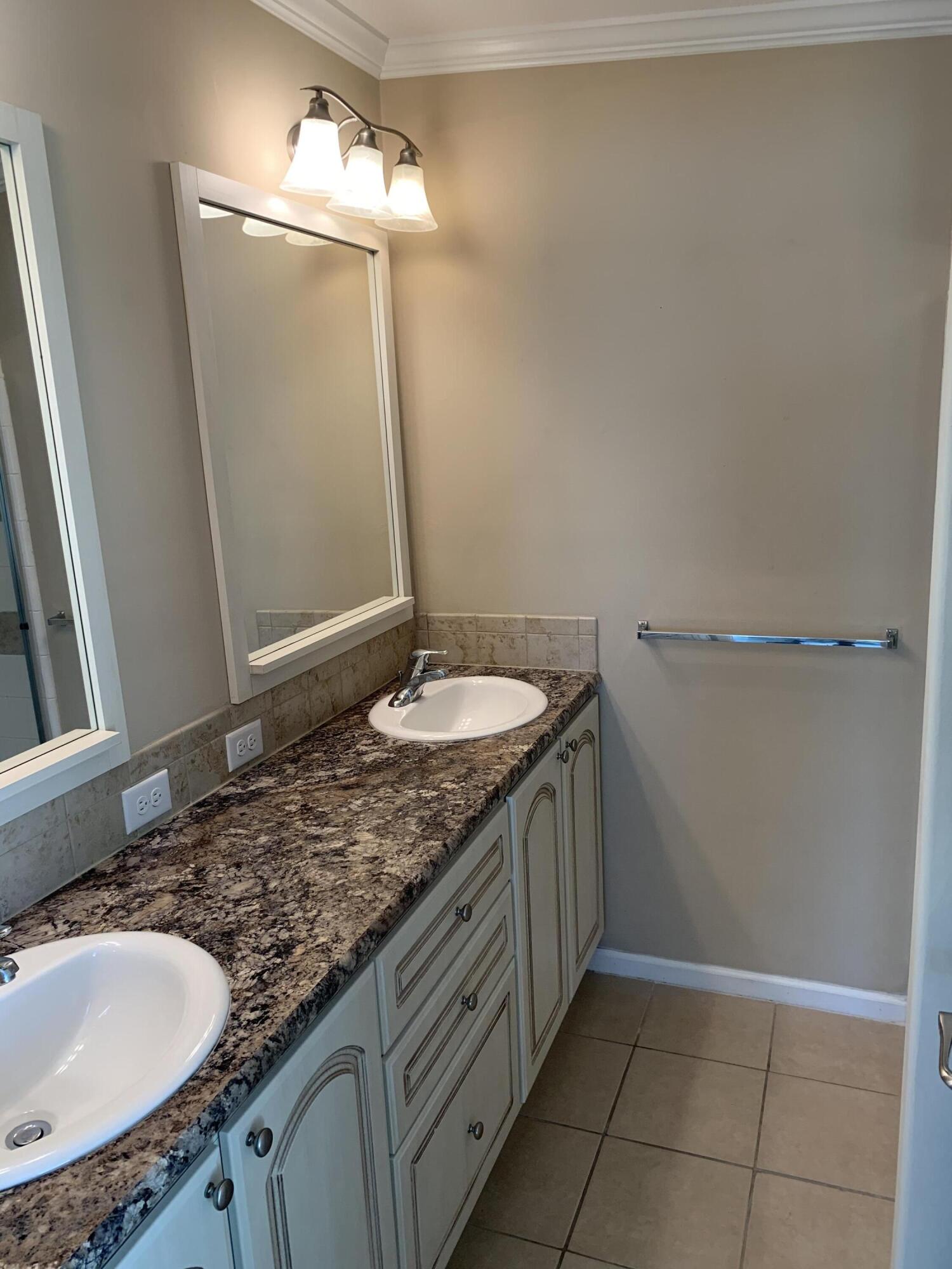 28511 Channel View Drive Summerland Key, FL 33042 - Photo 5 of 14 a bathroom with a granite countertop sink and a mirror