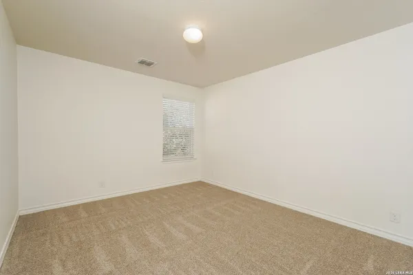 an empty room with a empty space and window