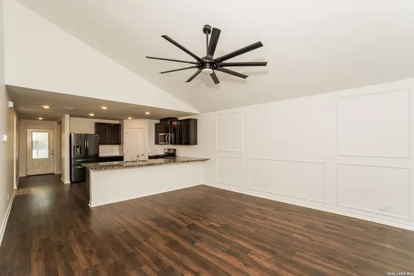 a view of a kitchen with a sink and microwave