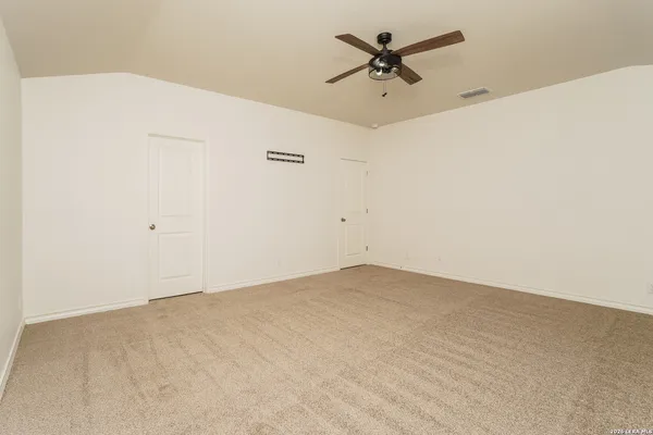 a view of a big room with carpet