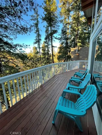 a view of balcony with wooden floor