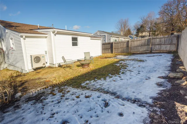 a view of a backyard with large tree