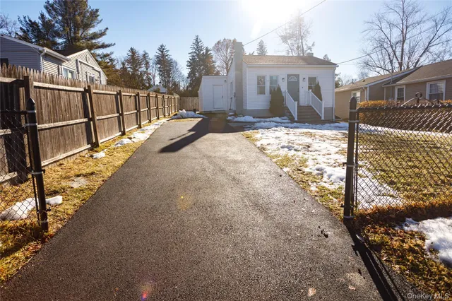a view of a house with snow in the background