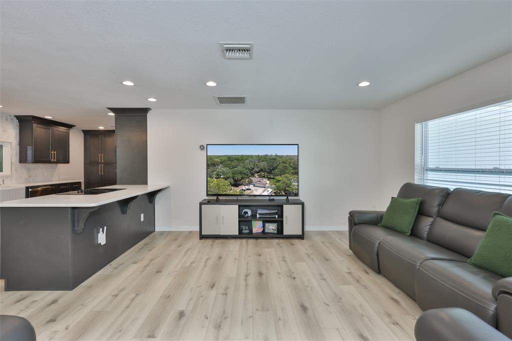 1578 Indian Bay Road Spring Hill, FL 34607 - Photo 11 of 51 a living room with furniture and a flat screen tv