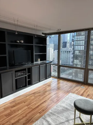 a view of a kitchen with furniture and a window
