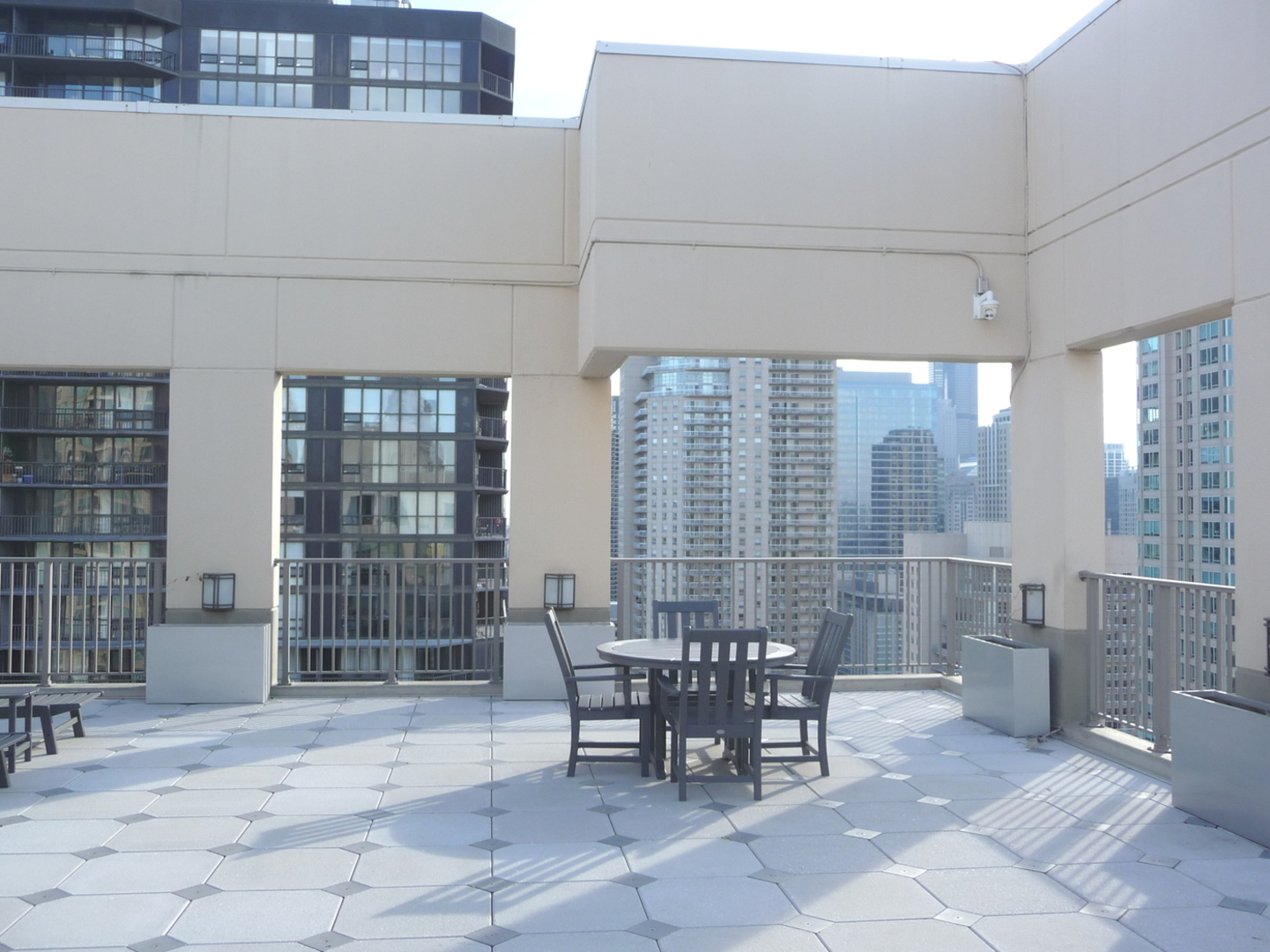 2 East Erie Street, Unit 2204 Chicago, IL 60611 - Photo 20 of 25 a view of a dining room with furniture and chandelier