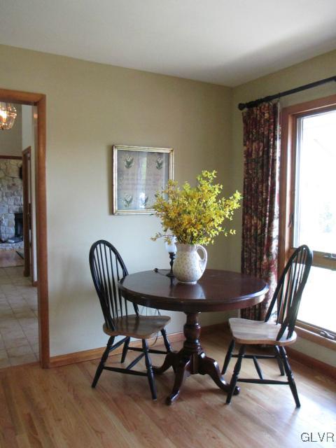 343 Forest Road Nazareth, PA 18064 - Photo 15 of 32 a view of a dining room with furniture and wooden floor