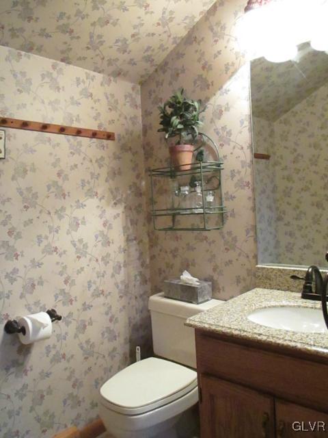 343 Forest Road Nazareth, PA 18064 - Photo 26 of 32 a bathroom with a granite countertop toilet and a sink