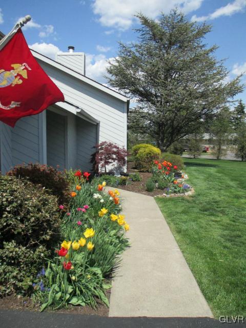 343 Forest Road Nazareth, PA 18064 - Photo 4 of 32 a front view of a house with a yard and potted plants