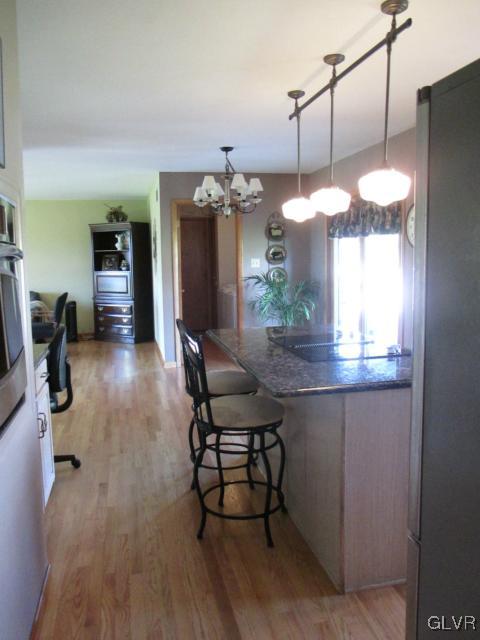 343 Forest Road Nazareth, PA 18064 - Photo 8 of 32 a view of a dining room with furniture and a chandelier