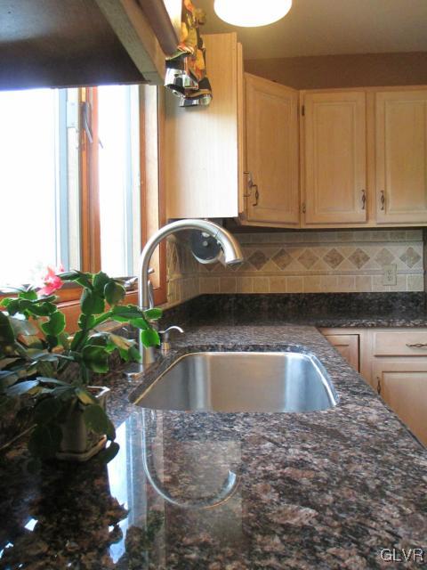 343 Forest Road Nazareth, PA 18064 - Photo 9 of 32 a kitchen with a sink a counter top space and a couch
