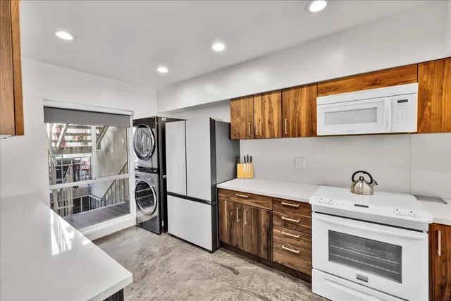a kitchen with stainless steel appliances a stove and a refrigerator