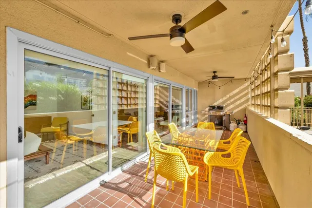 a view of a patio with a table and chairs