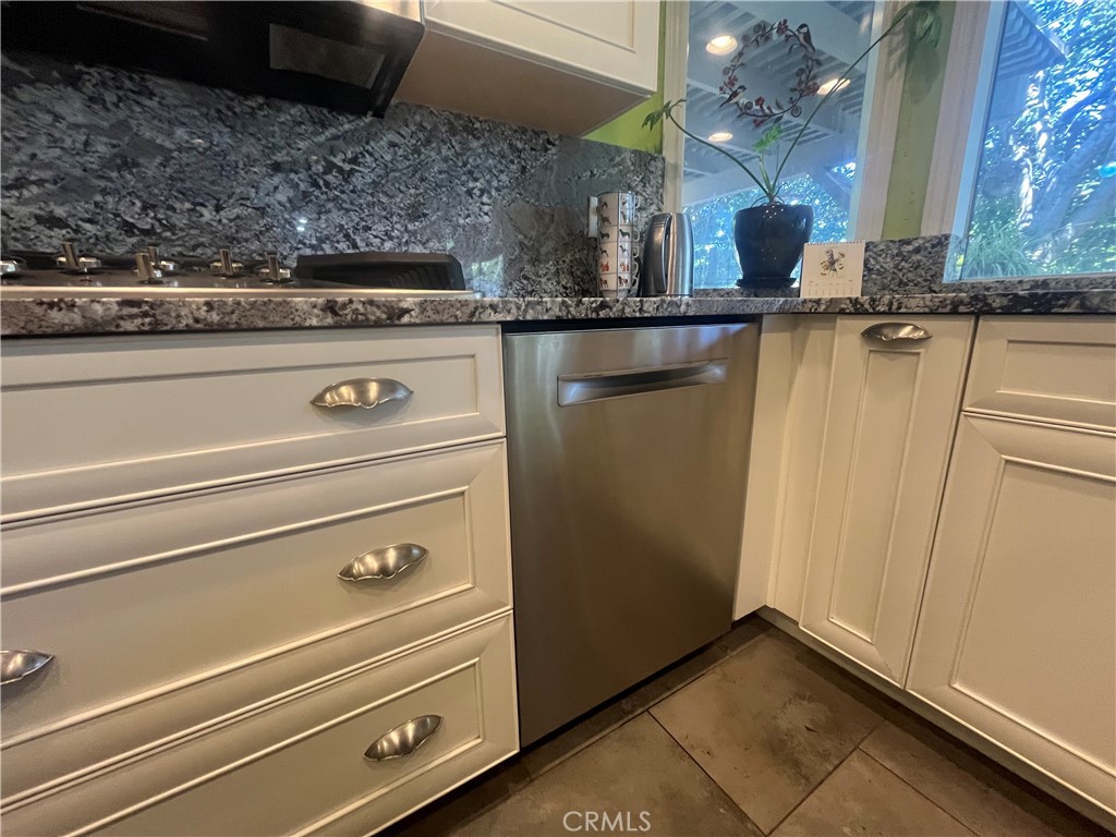 31420 Corte Madera Temecula, CA 92592 - Photo 12 of 54 a stove top oven sitting inside of a kitchen