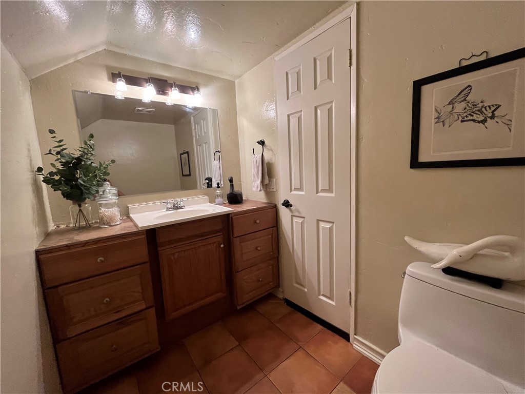 31420 Corte Madera Temecula, CA 92592 - Photo 18 of 54 a bathroom with a double vanity sink mirror and toilet