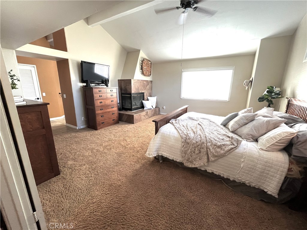 31420 Corte Madera Temecula, CA 92592 - Photo 22 of 54 a bedroom with bed mirror and window