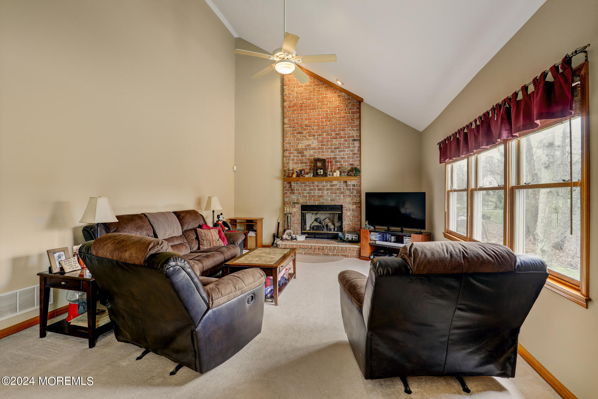 388 Jackson Mills Road Freehold, NJ 07728 - Photo 14 of 37 a living room with furniture fireplace and a window
