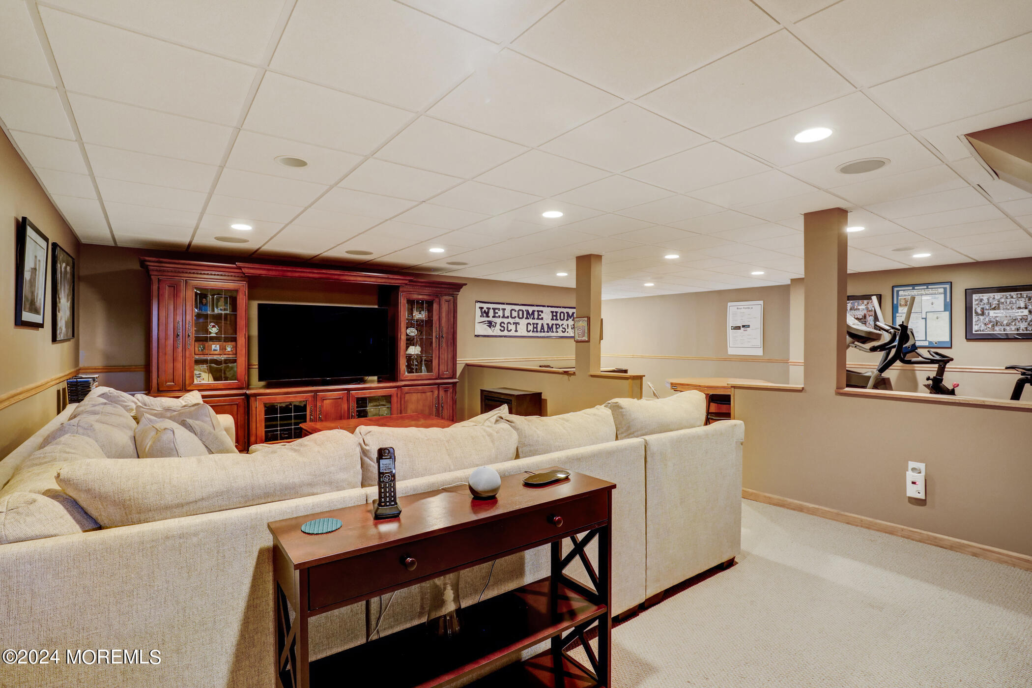 388 Jackson Mills Road Freehold, NJ 07728 - Photo 28 of 37 a living room with furniture and a flat screen tv