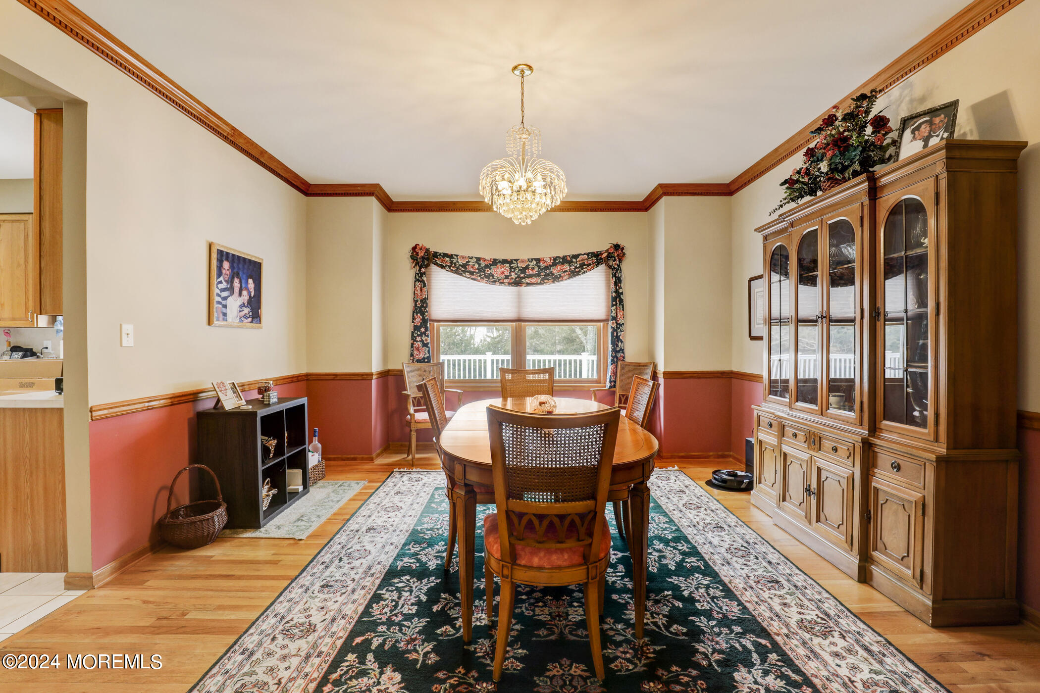 388 Jackson Mills Road Freehold, NJ 07728 - Photo 7 of 37 a dining room with furniture a rug and a chandelier