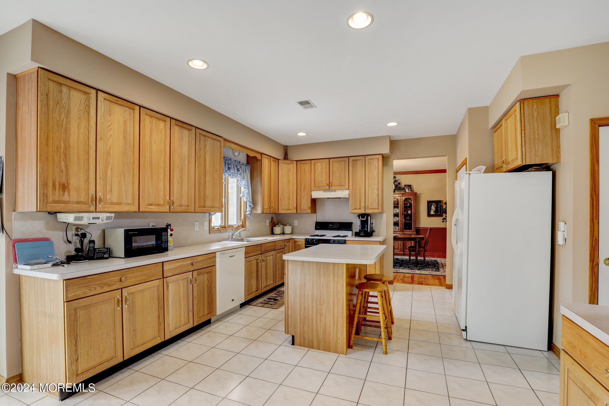 388 Jackson Mills Road Freehold, NJ 07728 - Photo 10 of 37 a kitchen with a sink a counter top space cabinets and stainless steel appliances