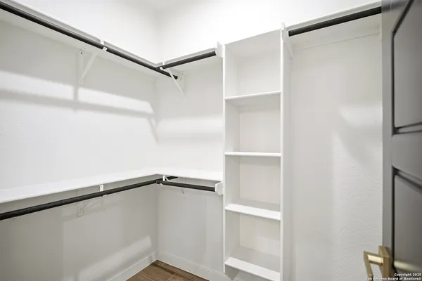 a view of an empty walk in closet