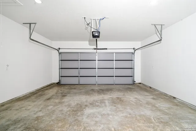 a view of a garage with shelf