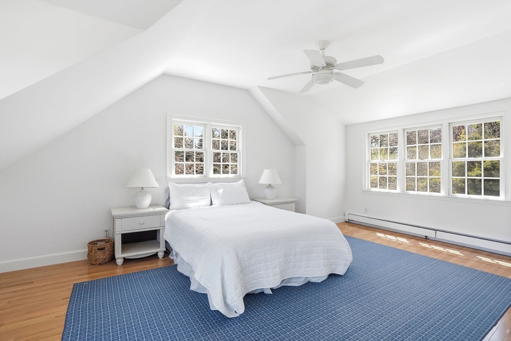 34 Governor Long Road Hingham, MA 02043 - Photo 11 of 37 a bedroom with a bed and a window