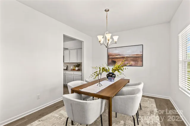a kitchen with refrigerator and cabinets